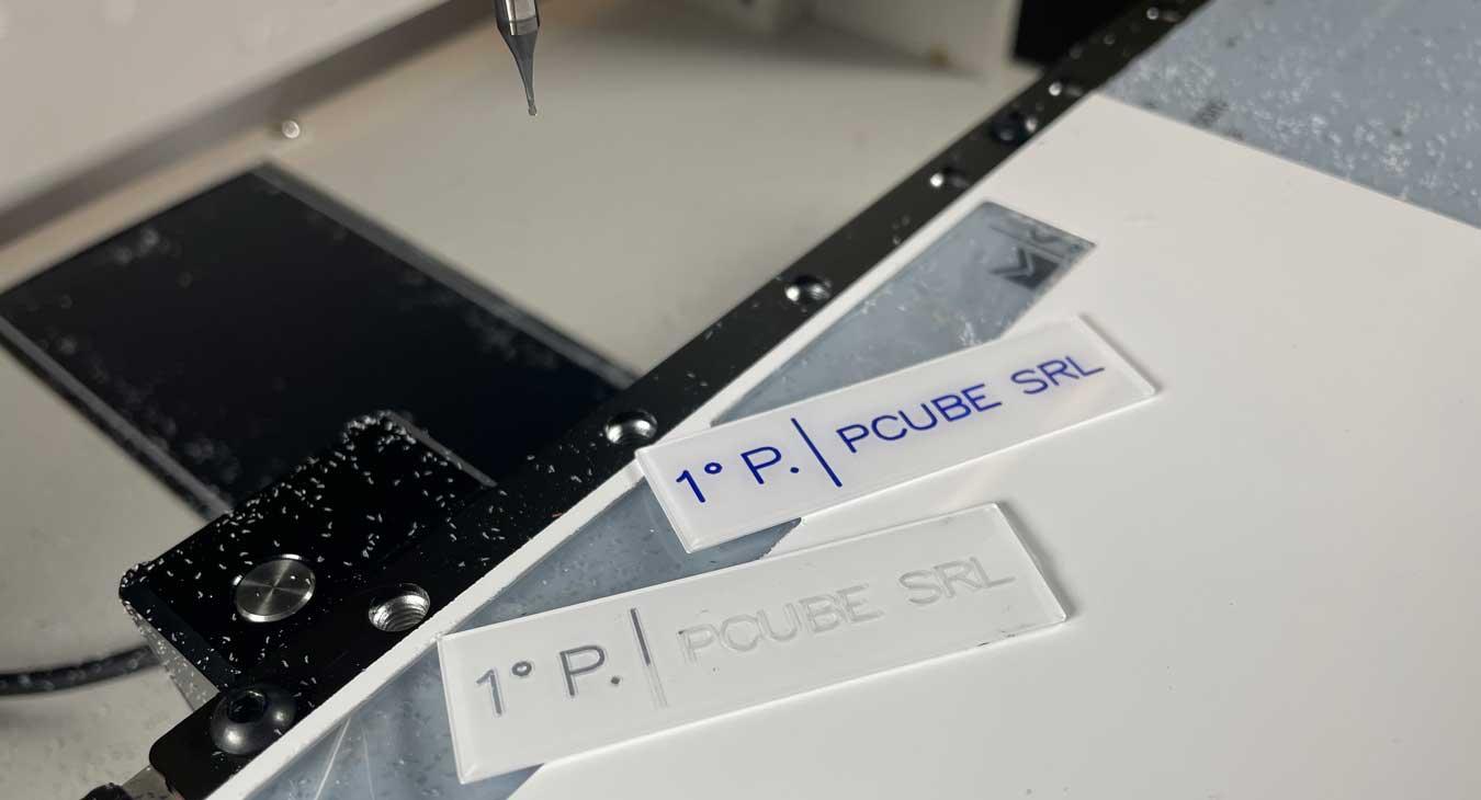 Engraving and cutting of nameplates from a plate